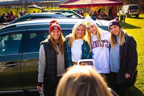 group of young women in Lafayette gear smile while friend takes their photo
