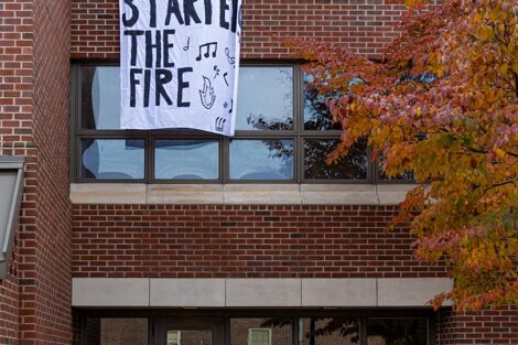 A banner hanging in College Hill reads: Lehigh started the fire