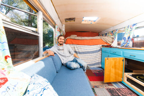 Remy Oktay '23, a 2021 STEM Star, inside of the bus he converted into a solar-powered livable space