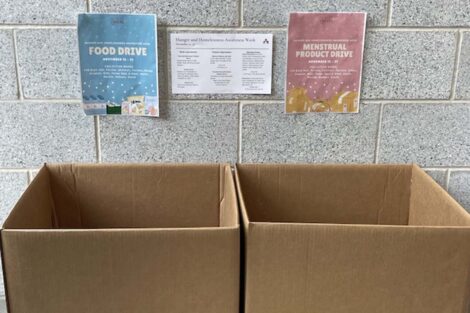 Two boxes collect food and menstrual products