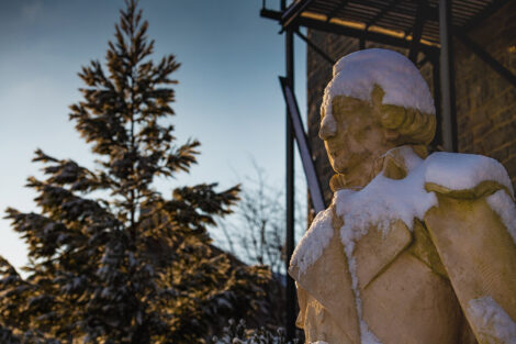 Statue of Marquis de Lafayette, covered in snow.