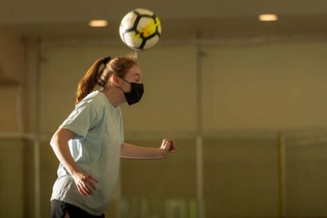 Student actor heads the soccer ball