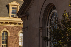 close up shot of Colton Chapel and Pardee in the background with warm sun setting
