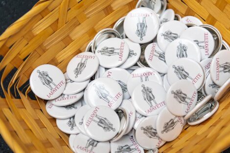 a basket of Marquis-themed pins