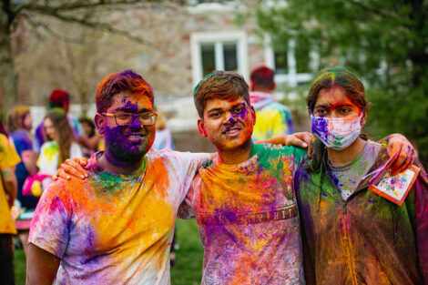Students covered in colorful powder.