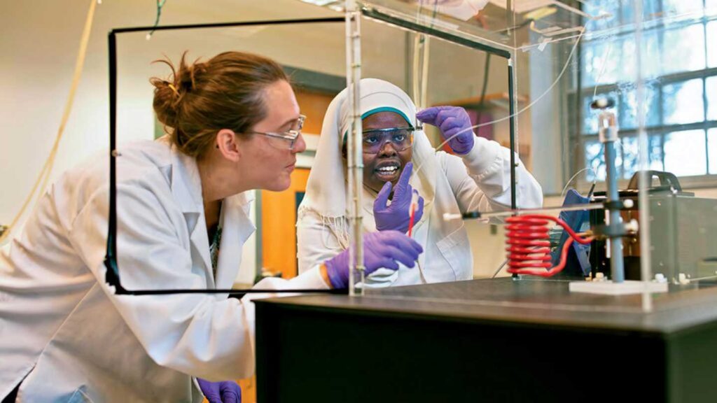 Zoe Boekelheide, associate professor of physics at Lafayette, conducting scientific research with a student in a science lab