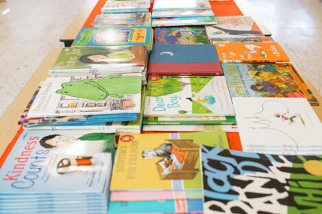 a long table displays children's books