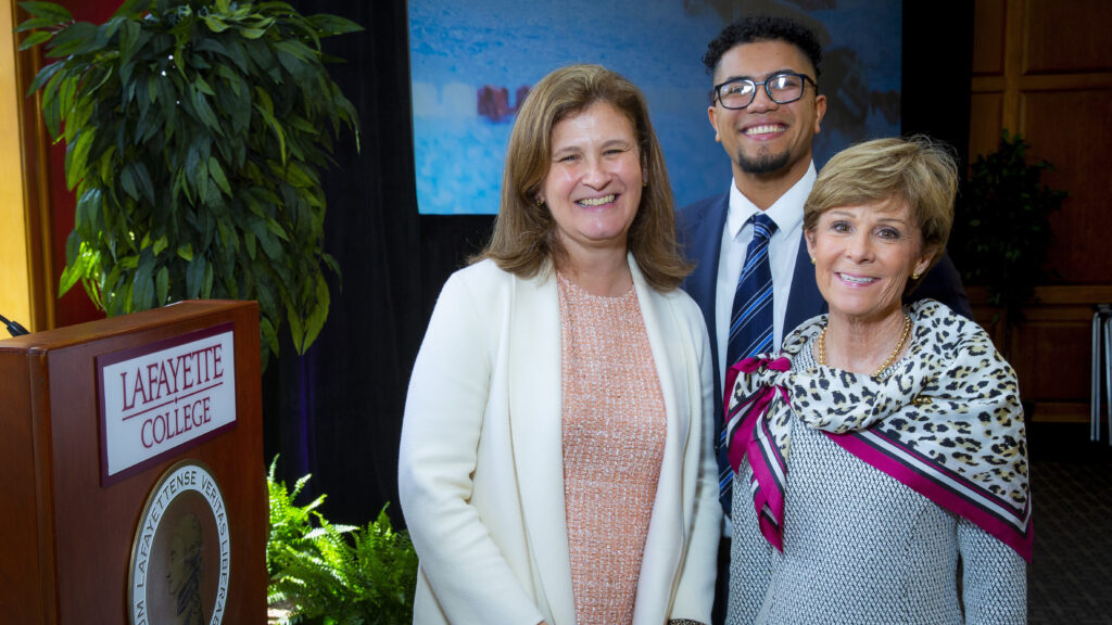 President Nicole Farmer Hurd stands with scholarship recipient Devin On '22 and Betsy Fadem '76, who created a scholarship, during the scholarship reception held on April 9.