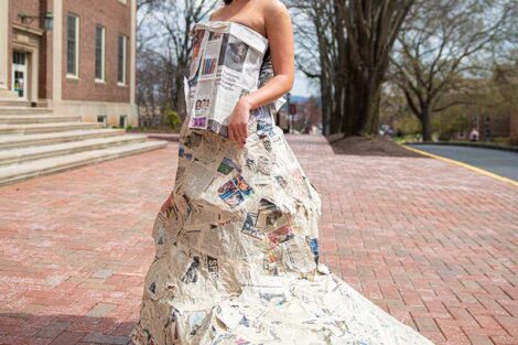 Student wears wedding dress made of newspaper