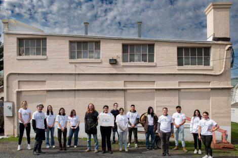 Class stands outside EPI in the shirt they designed and printed