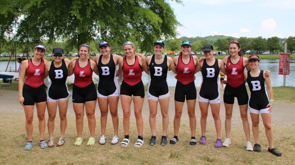 women's Lafayette crew members line up and smile with crew members from Bowdoin
