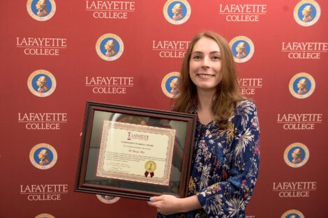 student holds Pi Beta Phi's Commitment to Service Award