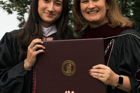 Erika Nally ’22 accepts her diploma from President Hurd