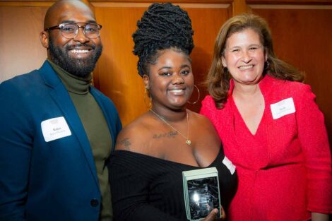 Standing in Marquis Hall, Director of Intercultural Development Robert Young '14 and President Nicole Farmer Hurd present the Jeffrey Robinson ’80 Leadership Award to Reanna West '22.