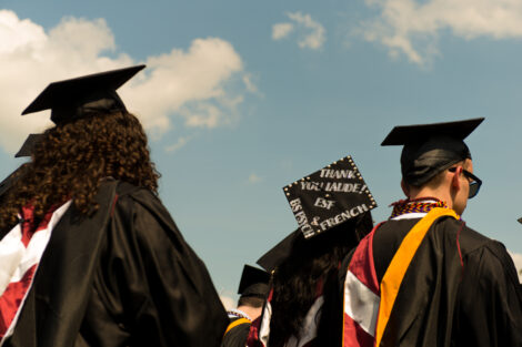 A graduation cap reads 