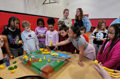 Second graders from Paxinosa Elementary interact with a water table with Prof. Kelleher's class