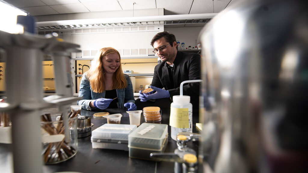 Samantha Ganser '23 and Prof. Justin Hines work together in Hines' lab on prion elimination mechanism studies