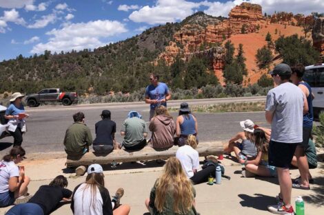 Prof. David Sunderlin gives a roadside lecture to students on the summer 2022 National Parks geology trip