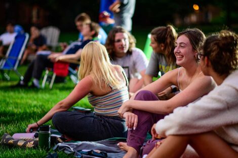 Lafayette students sitting on the lawn of the Quad awaiting the free outdoor movie screening