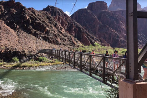 Students on Summer 2022 geology trip cross a bridge in a national park