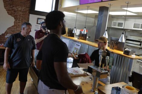 Lafayette football players and head coach John Troxell surprise employees at Easton's Don Juan's restaurant with Lafayette football jersey and tickets