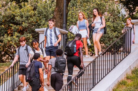 A line of students walk down a staircase on Lafayette College's campus.