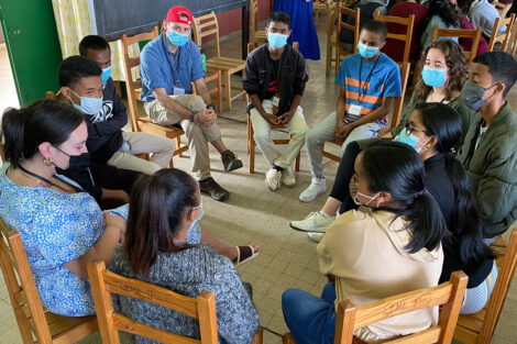 A LIME group discussion takes place as students and mentors sit in a circle at Lycée Andohalo in Antananarivo, Madagascar.