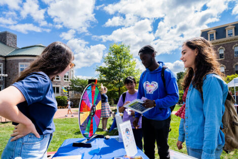 Students speak to each other on the Quad.