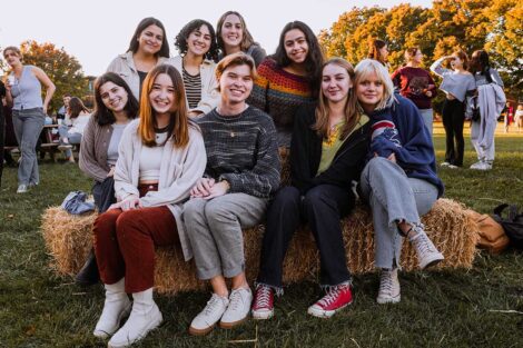 Group of Lafayette students sitting on hay bale on the Quad at Fall Fest 2022