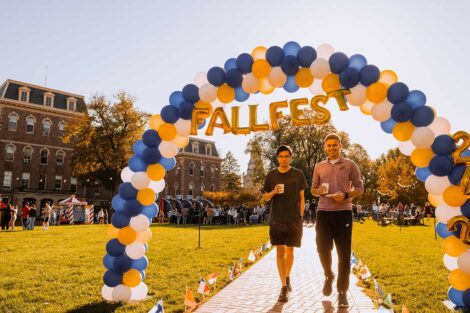 Students walking below Fall Fest banner on the Quad at Lafayette's Fall Fest 2022
