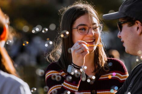 Student blowing bubbles on the Quad at Lafayette's Fall Fest 2022