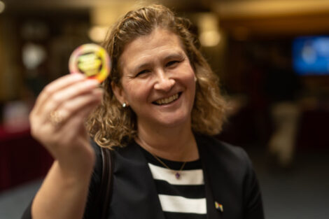 President Nicole Farmer Hurd displays a sticker during the National Coming Out Day Celebration and Resource Fair.