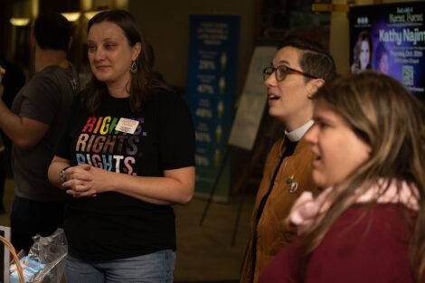 Chaplain Alex Hendrickson and two other Lafayette community members are pictured during the National Coming Out Day Celebration and Resource Fair.
