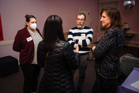 Community members talk inside Lavender Lane.