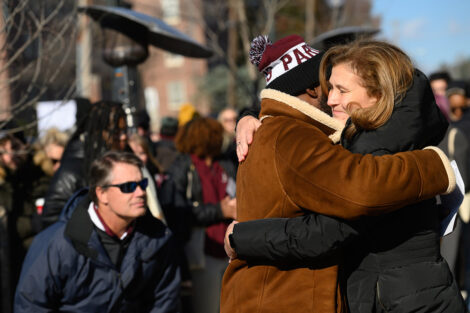 President Nicole Hurd and Rob Young embrace.