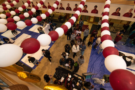 Farinon College Center filled with students, with maroon and white balloons hanging.