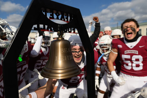 Lafayette players ring a bell that reads Beat Lehigh