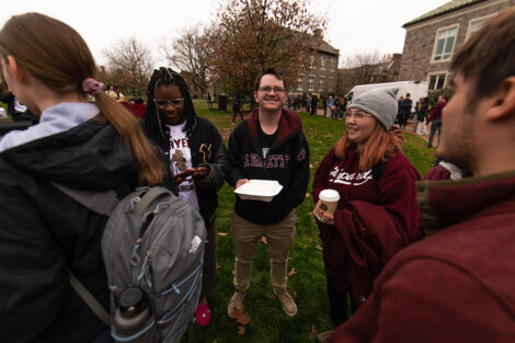 A group of students talk on the Quad.