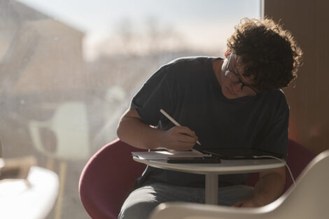 A student studies at a table.