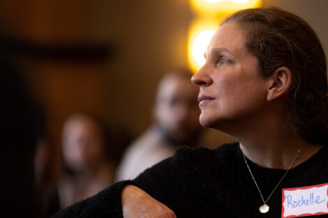 A member of the Lafayette College community listens to a speaker.