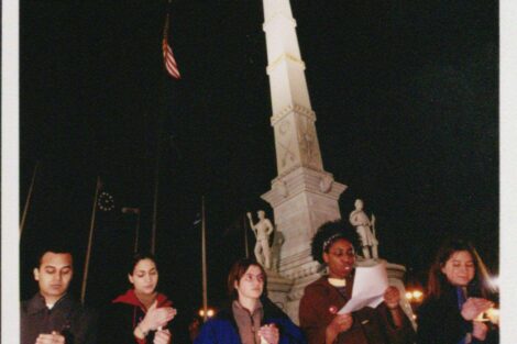 Women stand with candles in front of Centre Square