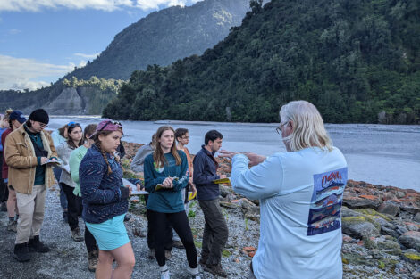 Prof. Germanoski teaches students in front of a large mountain.