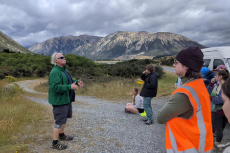 Prof. Germanoski teaching students near Arthur’s Pass, in front of a beautiful mountain.