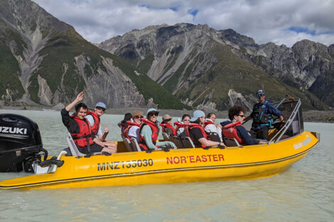 Students and professors on a boat in Lake Tasman.