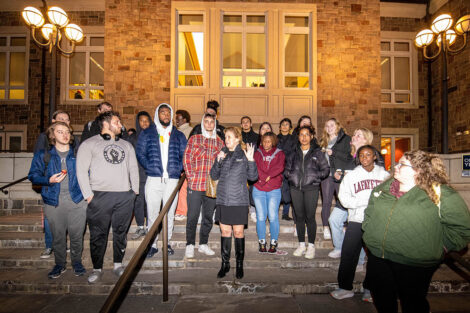 President Nicole Hurd speaks to a group of students on the steps of Farinon College Center.