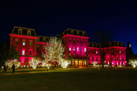 Pardee Hall in maroon lights as part of Founders' Day.