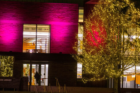 Skillman Library in maroon lights.