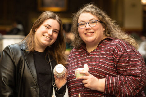 Students smile, holding ice cream during Founders' Day