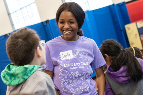 A Lafayette student smiles as she assists elementary students.