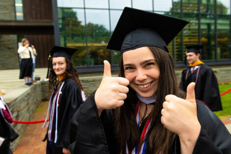A student gives the thumbs up.